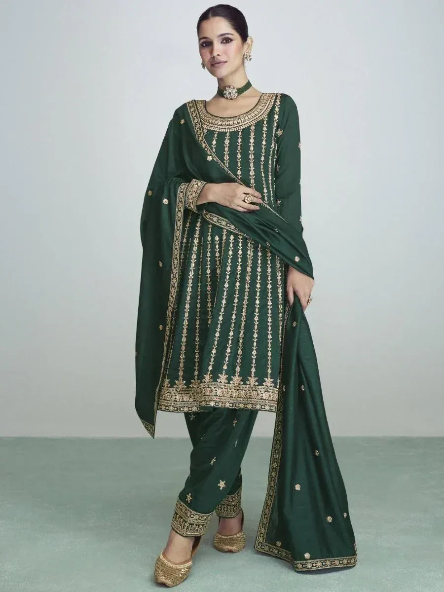 Emerald green embroidered salwar kameez with gold detailing, perfect for Indian ethnic wear occasions
