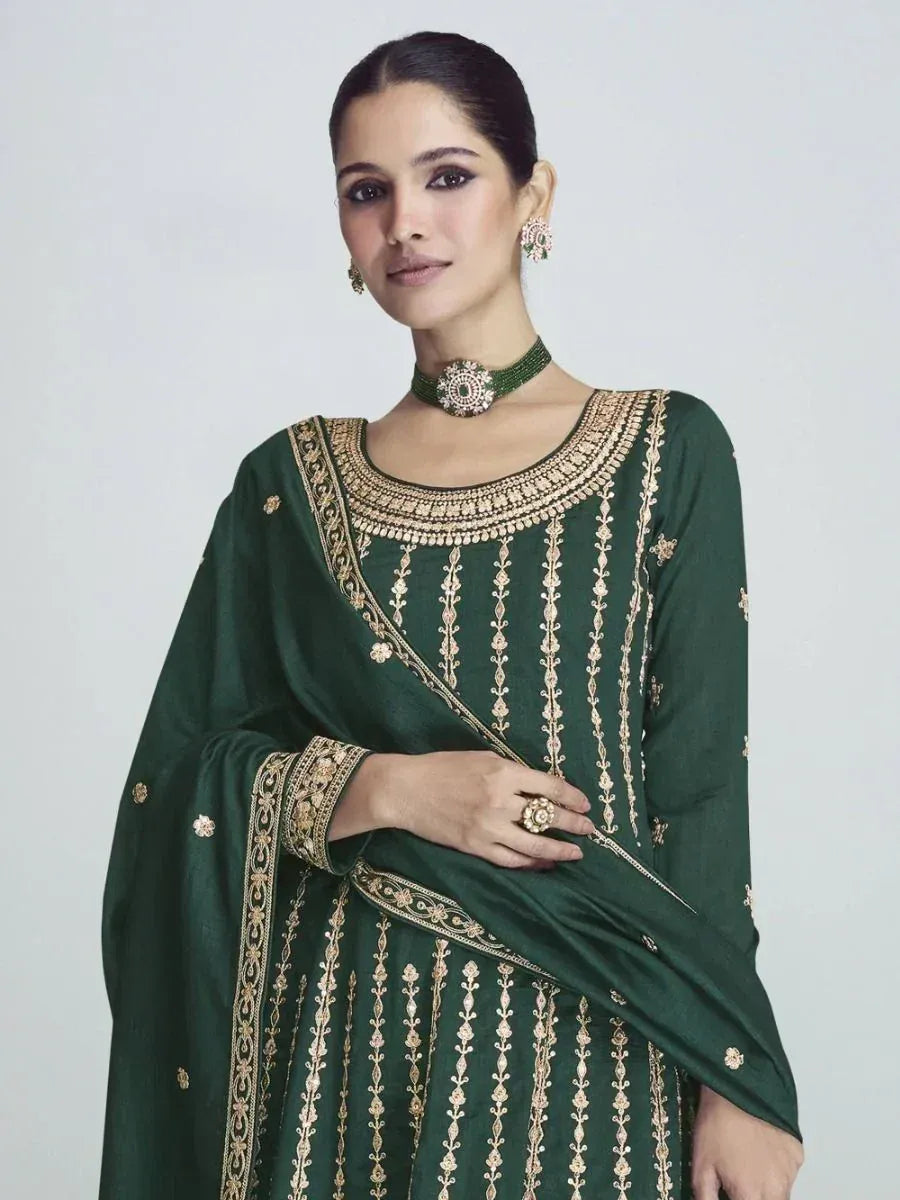 Emerald green embroidered salwar kameez with gold detailing, perfect for Indian ethnic wear occasions.