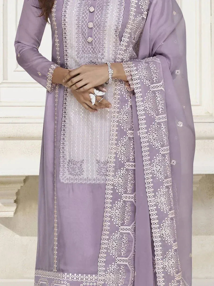 Lavender ethnic salwar kameez with white embroidery and dupatta, perfect for festive occasions.
