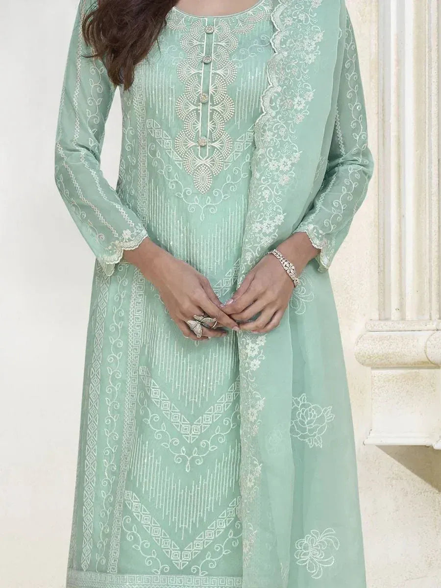 Mint green embroidered ethnic kurta with white threadwork and lace detailing, perfect for Indian wear.