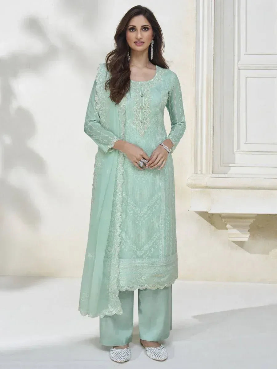 Mint green embroidered salwar kameez with lace dupatta, perfect for ethnic occasions