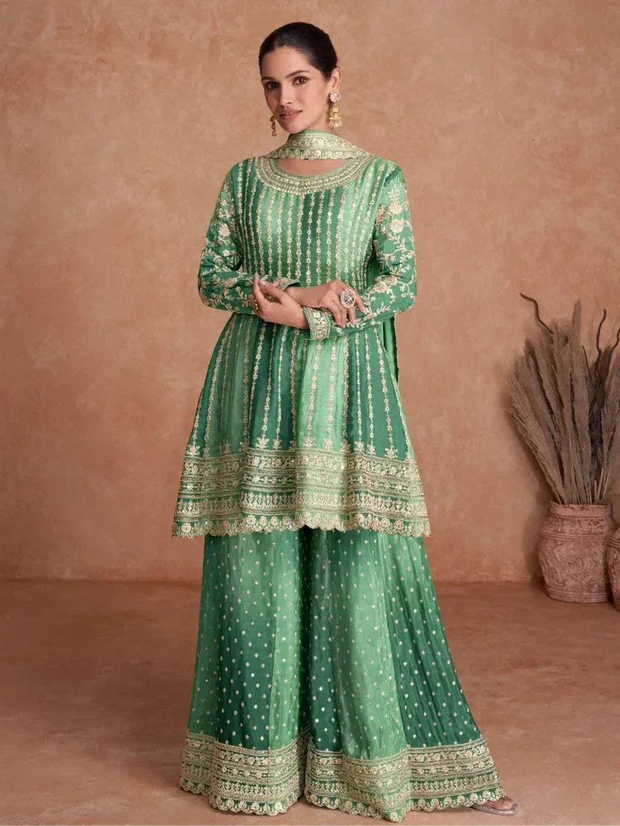 Green embroidered ethnic salwar kameez with gold detailing, perfect for Indian festive occasions