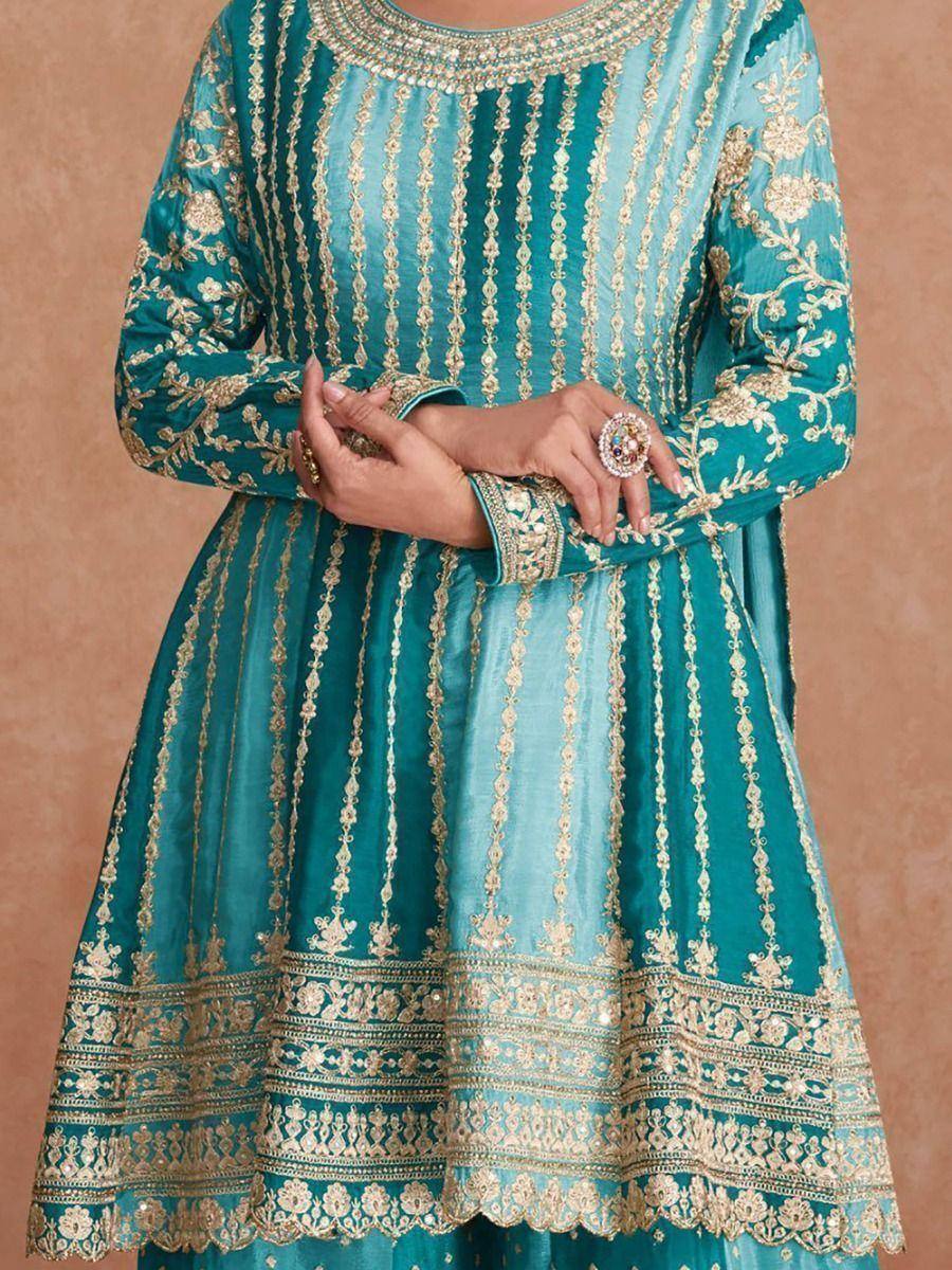 Teal ethnic gown with gold embroidery, perfect for Indian festive occasions and weddings.
