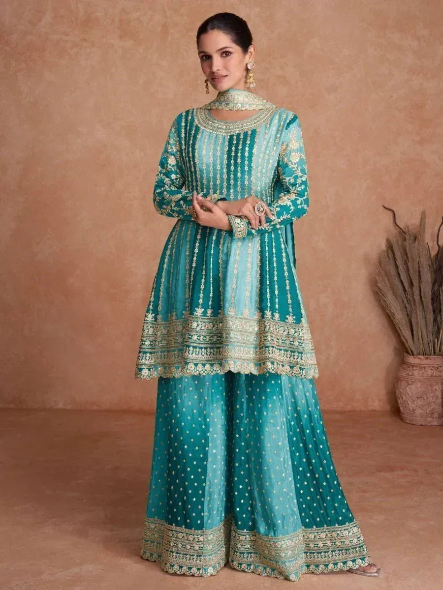 Teal embroidered Indian ethnic anarkali suit with gold detailing, perfect for weddings and festive occasions