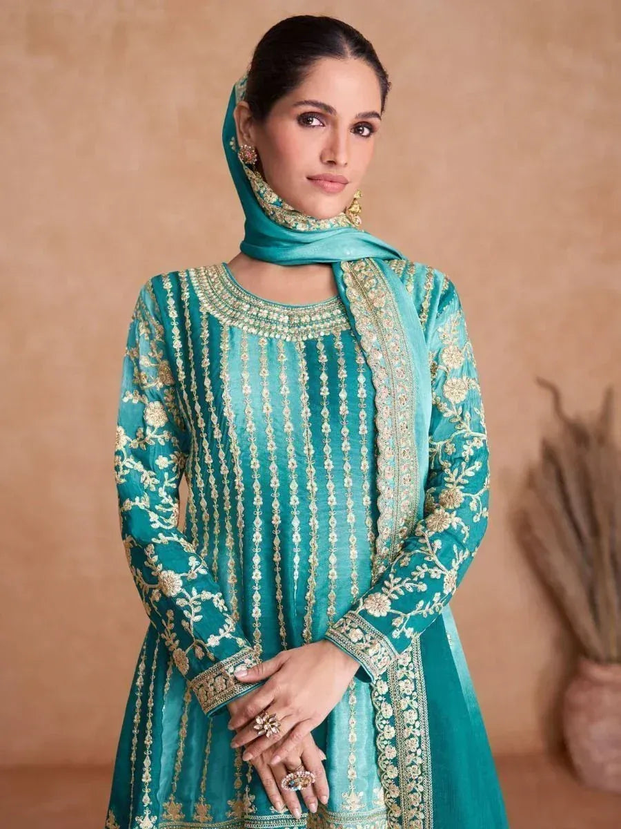 Teal embroidered salwar kameez with gold detailing and matching dupatta, perfect for Indian ethnic wear occasions