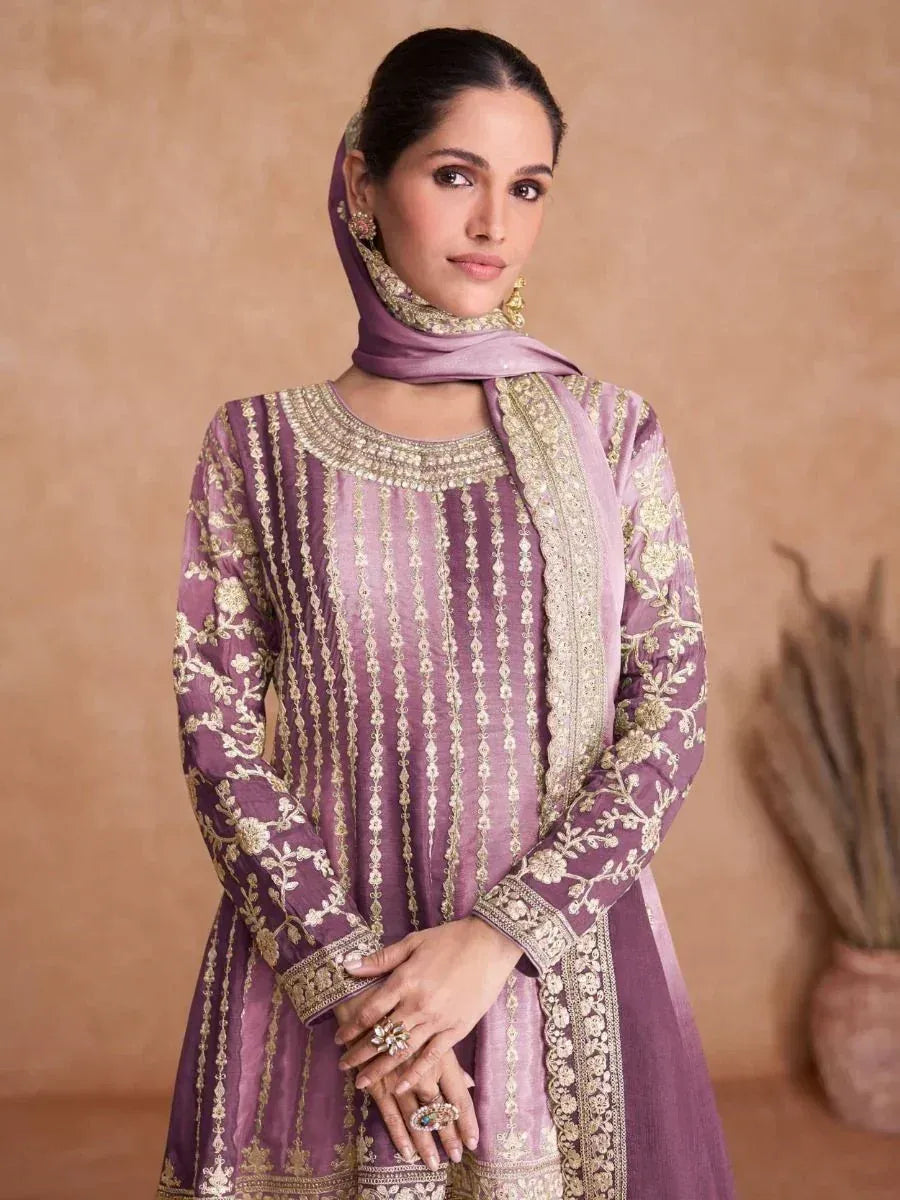 Purple embroidered salwar kameez with gold detailing and matching dupatta, perfect for Indian ethnic wear.