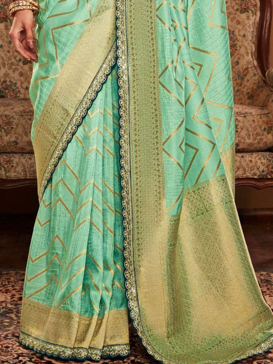 Mint green saree with gold geometric print and embroidered border, ethnic wear for women