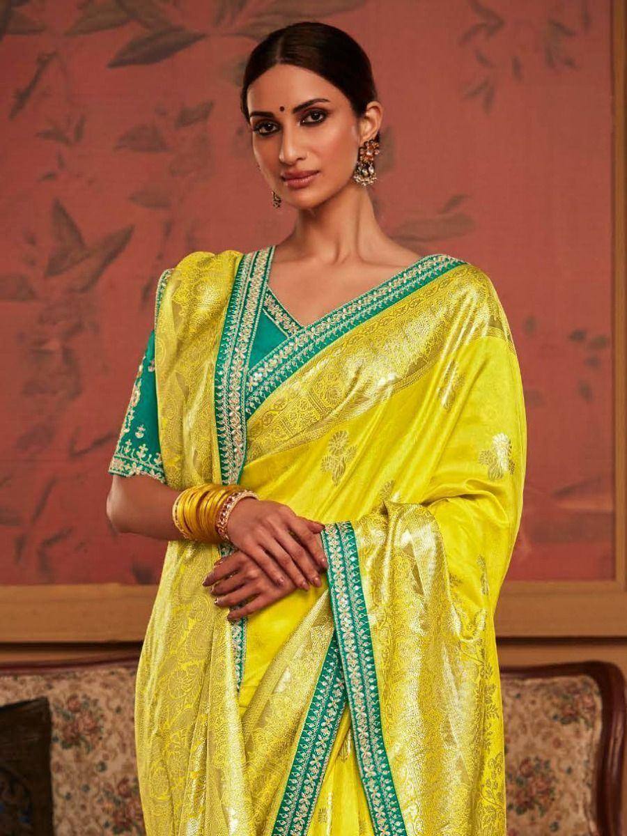 Vibrant yellow and green designer saree with intricate embroidery, perfect for ethnic occasions