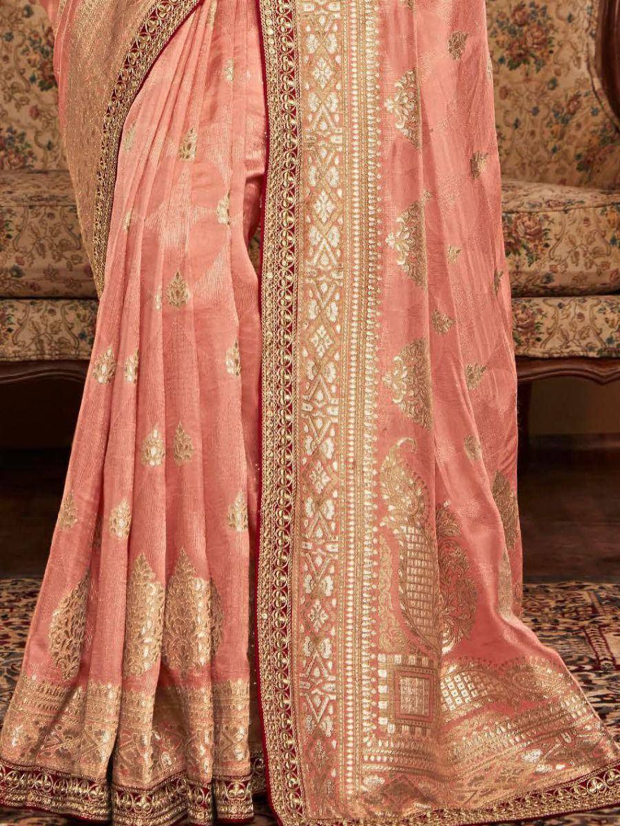 Pink designer saree with gold embroidery and intricate border, perfect for ethnic occasions
