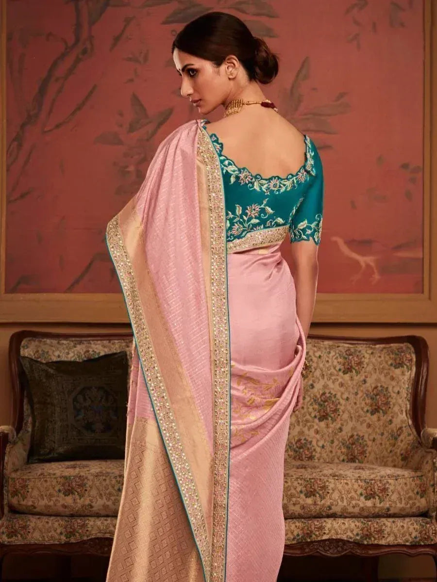 Pink saree with gold border and teal embroidered blouse, elegant Indian ethnic wear for women