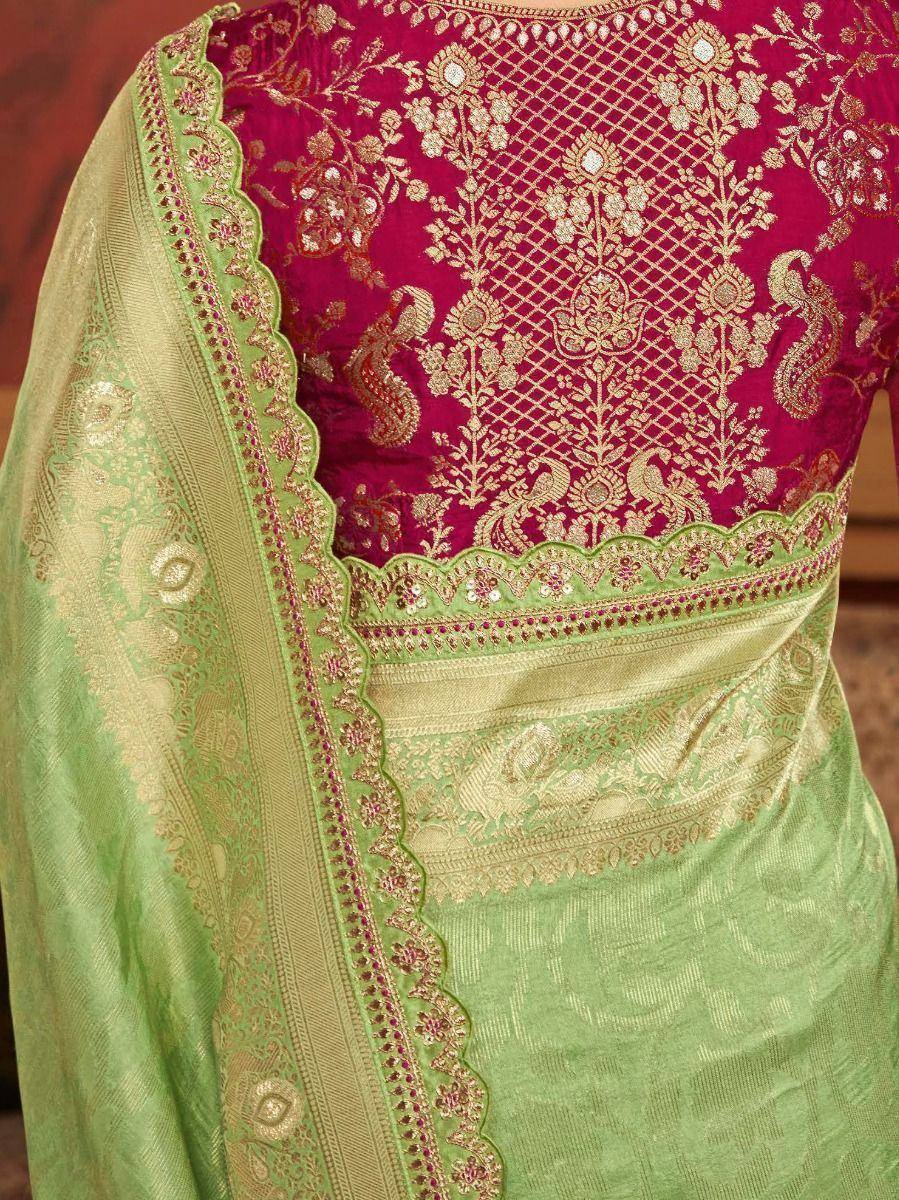 Elegant pink and green embroidered lehenga choli with gold zari work and scalloped dupatta border