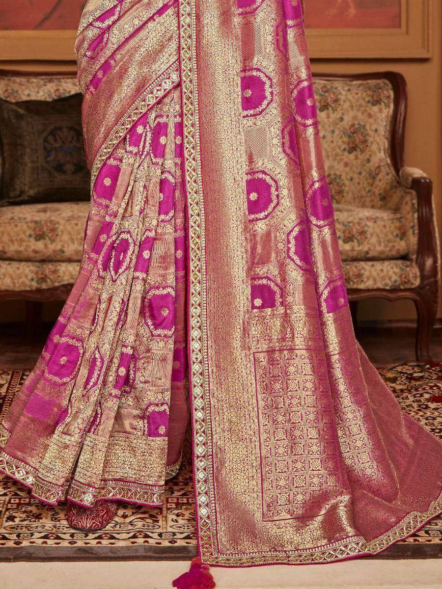 Pink and gold designer saree with intricate zari work and geometric patterns, perfect for ethnic occasions