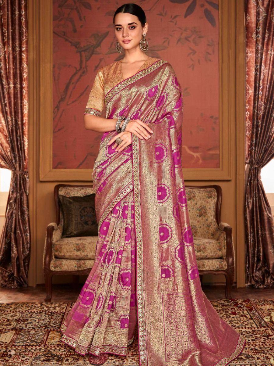 Elegant pink and gold designer saree with intricate patterns, perfect for Indian ethnic wear occasions