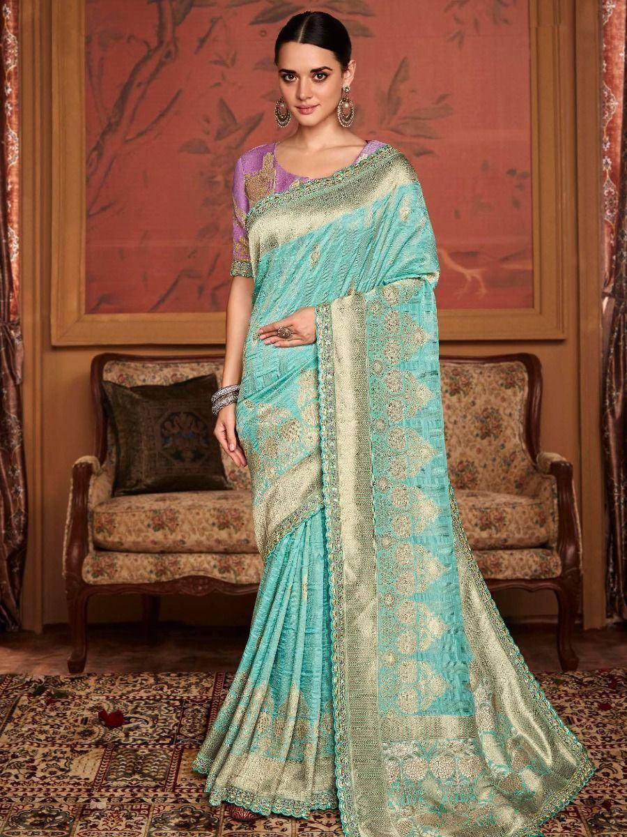 Turquoise designer saree with gold embroidery and purple blouse, ethnic Indian wear