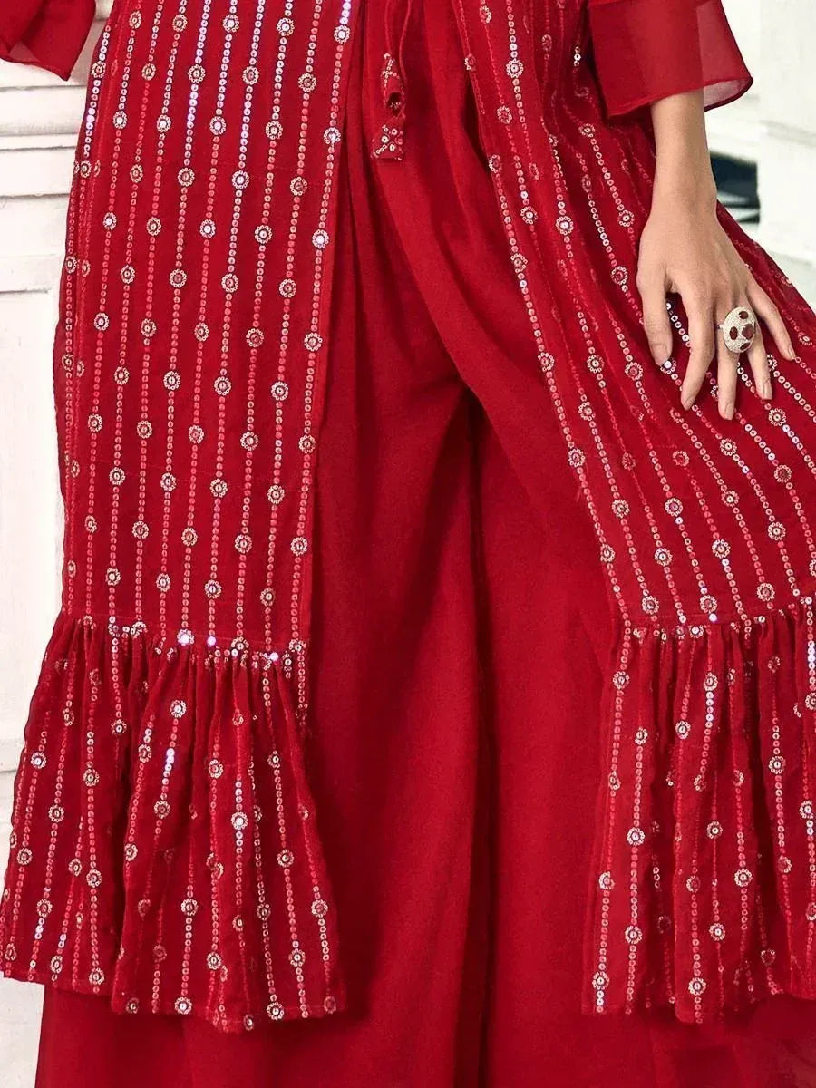 Red Indian ethnic outfit with sequin embroidery and flared ruffled details