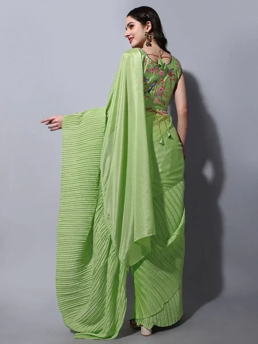 Green pleated ethnic gown with floral embroidery, perfect for Indian occasions and festive wear.