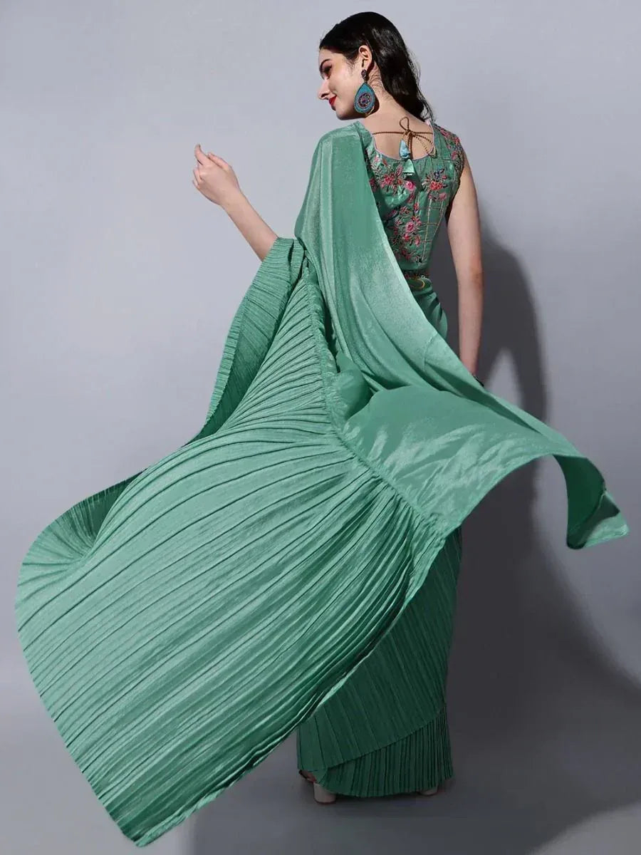 Green pleated ethnic gown with floral embroidery, perfect for Indian occasions