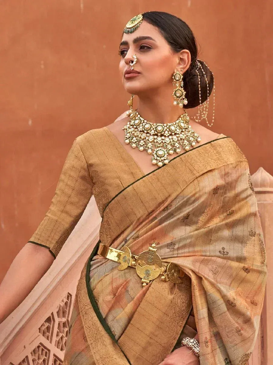 Elegant woman in golden saree with intricate embroidery, traditional jewelry, and temple-style belt, perfect for Indian ethnic occasions.