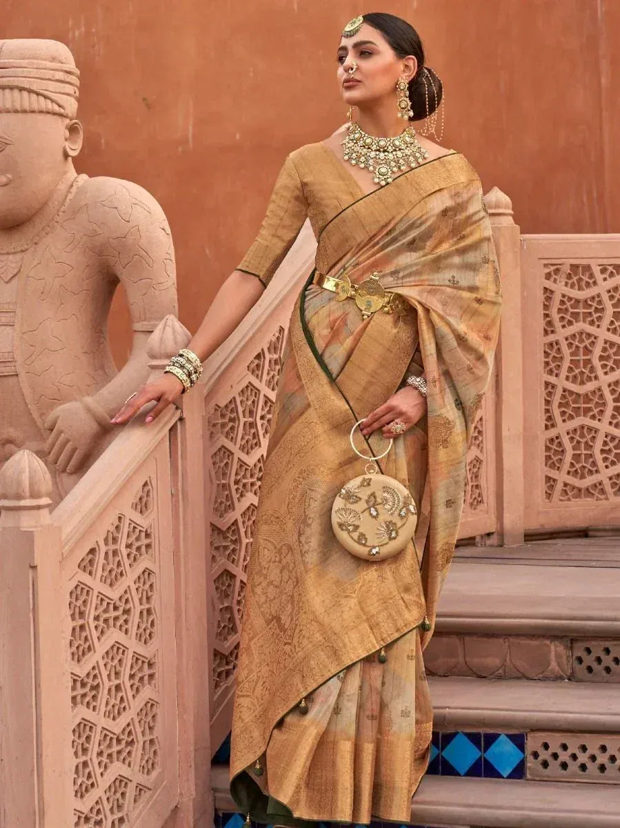 Elegant golden saree with intricate embroidery, paired with traditional jewelry and a round embellished clutch, perfect for ethnic occasions.