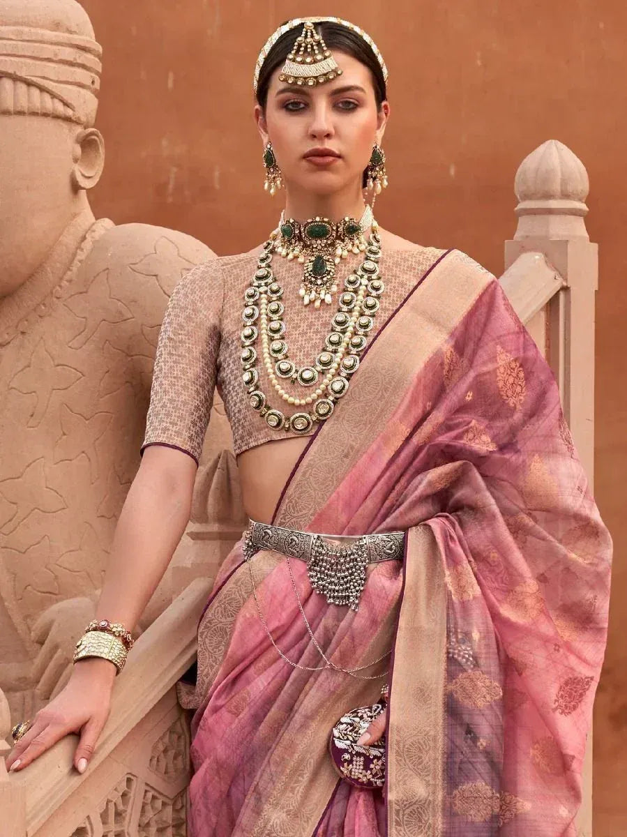 Elegant Indian woman in pink and gold saree with traditional jewelry, perfect for ethnic occasions