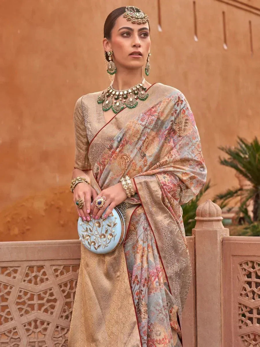 Elegant woman in floral printed saree with gold blouse, traditional jewelry, and blue clutch, perfect for Indian ethnic occasions