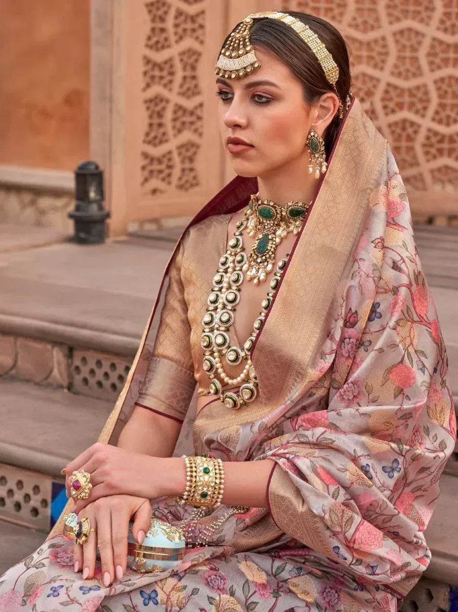 Elegant woman in floral printed saree with gold jewelry, traditional Indian ethnic wear