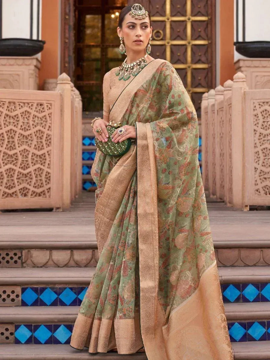 Elegant green and gold floral saree with heavy jewelry, perfect for Indian ethnic occasions
