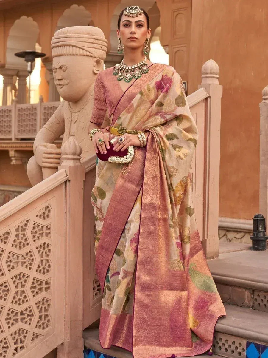 Woman in floral printed saree with pink border, traditional Indian ethnic wear, palace backdrop