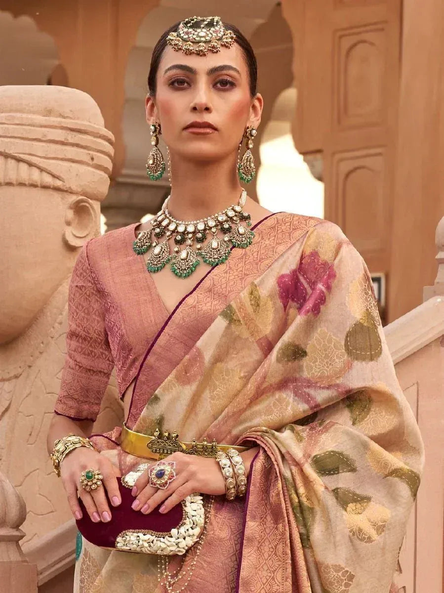 Elegant Indian saree with floral print, paired with traditional jewelry and a velvet clutch, perfect for ethnic occasions.