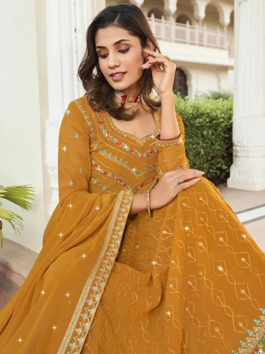 Mustard yellow embroidered anarkali suit with floral detailing, perfect for Indian ethnic occasions