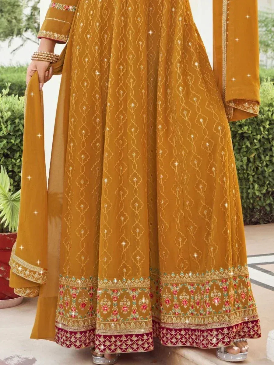 Mustard yellow ethnic anarkali with floral embroidery and mirror work, perfect for Indian occasions