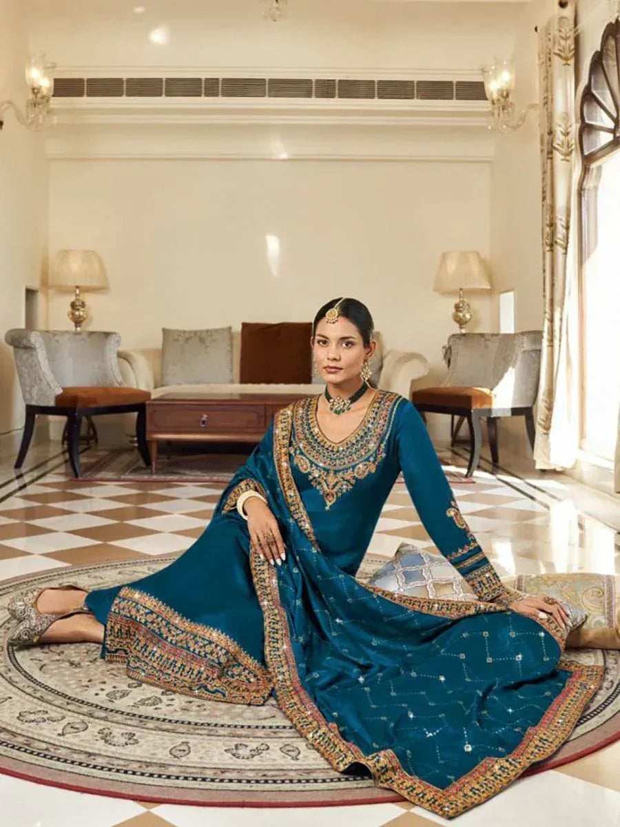 Teal designer salwar kameez with intricate gold embroidery, perfect for Indian ethnic occasions
