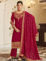 Woman in maroon and gold embroidered Indian salwar kameez with matching dupatta