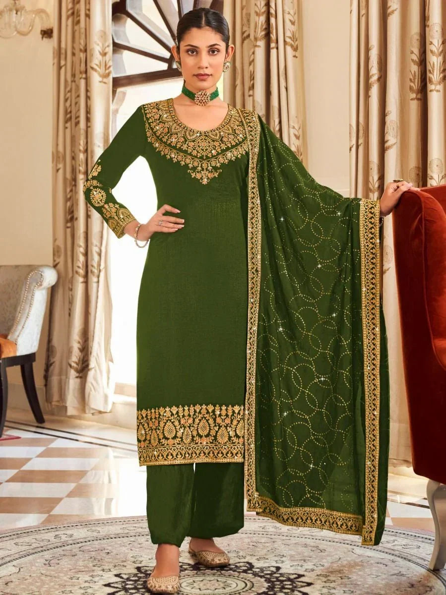 Woman wearing green embroidered salwar kameez with dupatta, traditional Indian ethnic wear