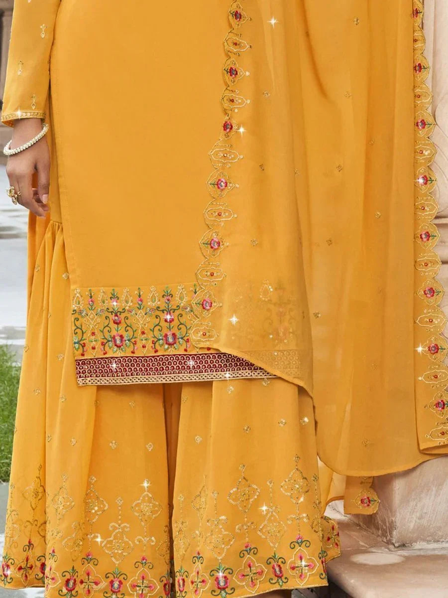 Mustard yellow embroidered Indian salwar kameez with floral and sequin detailing