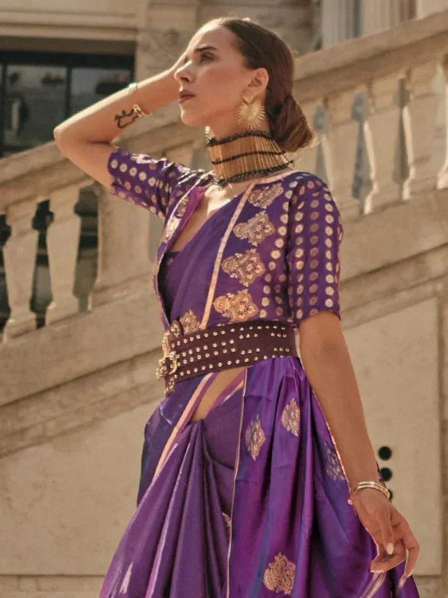Purple ethnic gown with gold embroidery, styled with statement jewelry for festive occasions