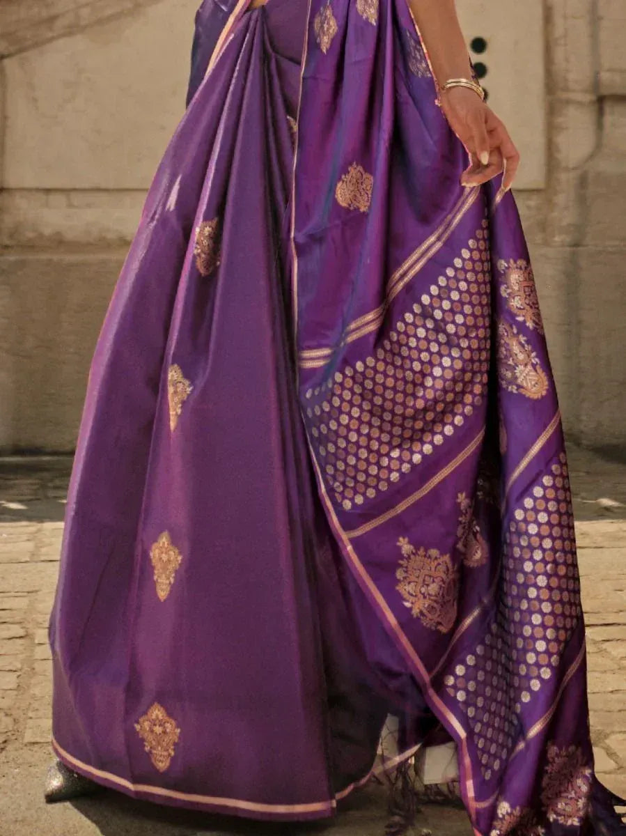 Purple silk saree with gold zari work and traditional motifs, perfect for ethnic occasions