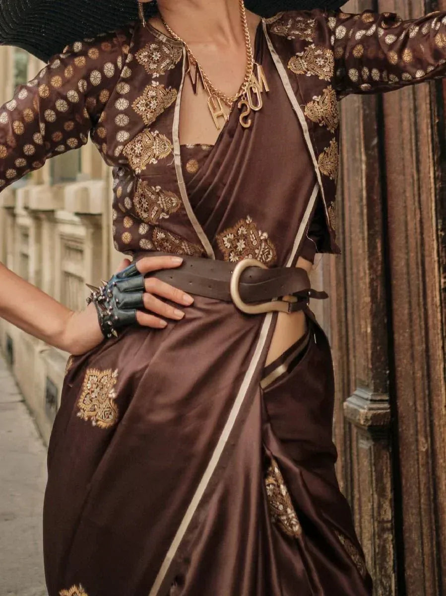 Brown embroidered saree with gold motifs, styled with belt and statement necklace for ethnic fashion