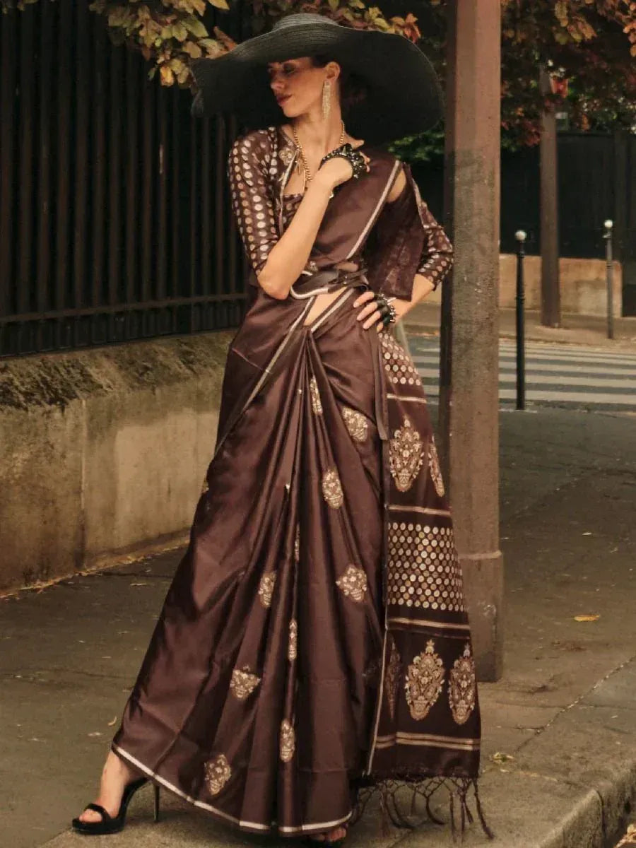 Elegant brown silk saree with gold embroidery, paired with polka dot blouse and wide-brim hat for ethnic fashion