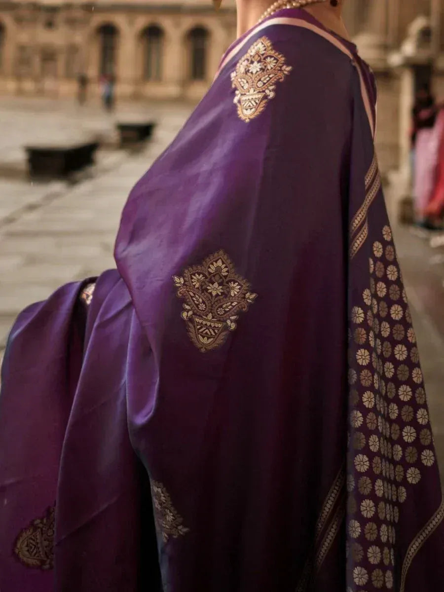 Purple ethnic saree with gold embroidery and floral border, perfect for Indian occasions