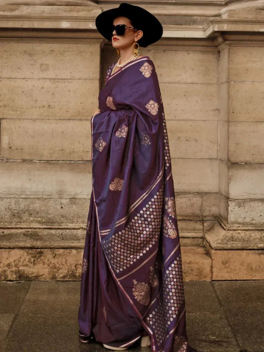 Purple designer saree with gold embroidery, styled with black hat and sunglasses for ethnic fashion