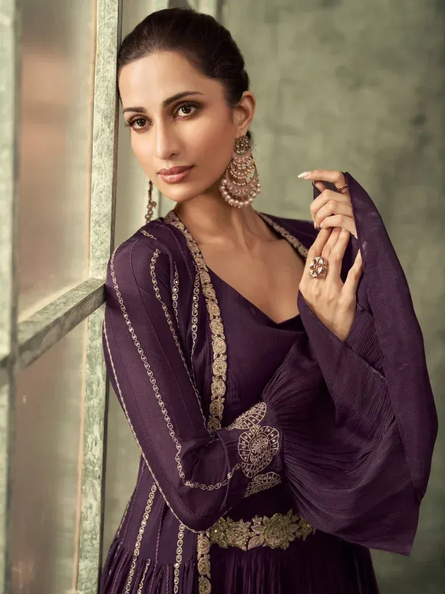Purple ethnic gown with gold embroidery, perfect for Indian occasions and festive wear.