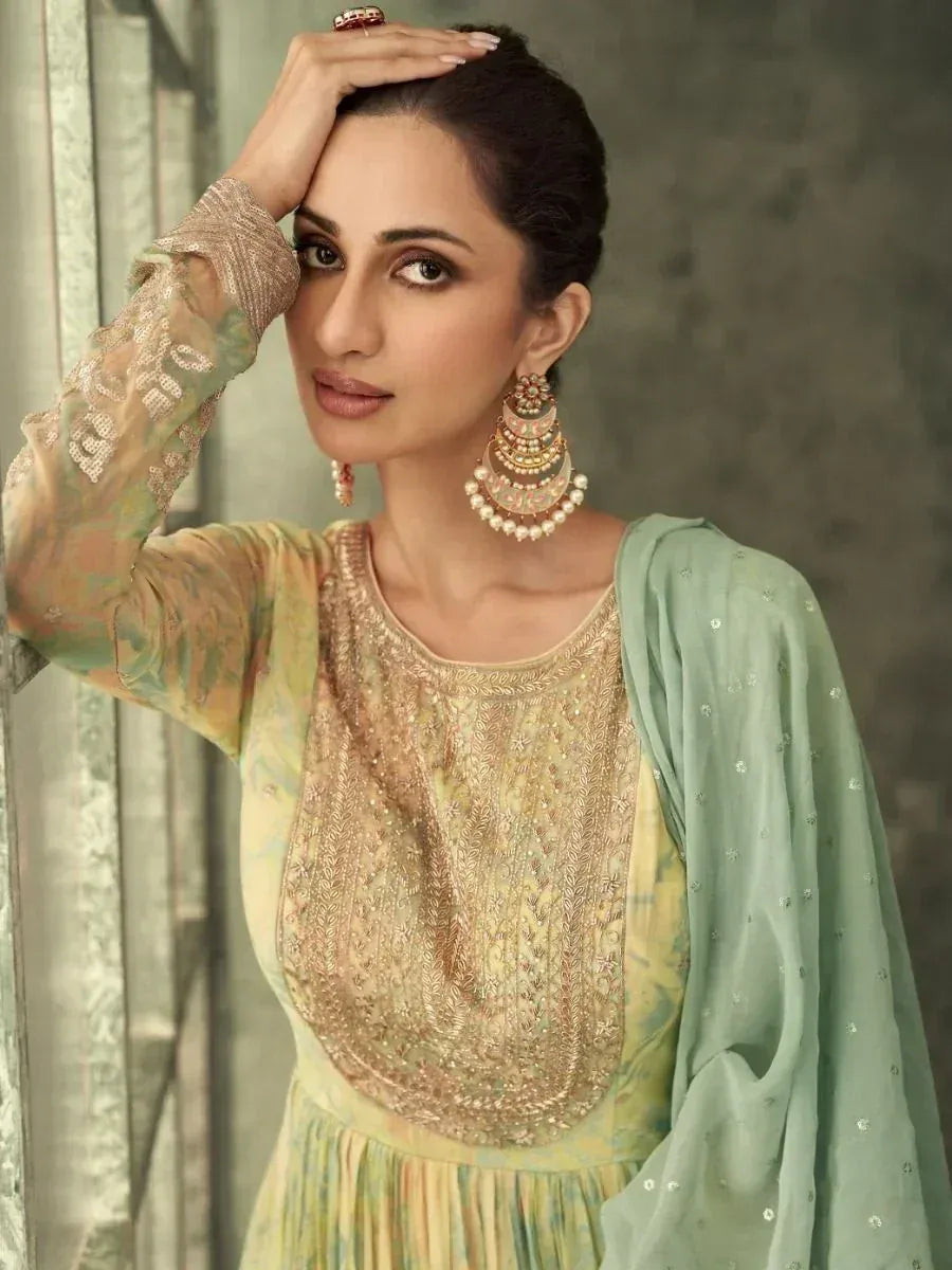 Elegant Indian ethnic wear with embroidered kurta and mint dupatta, perfect for festive occasions.