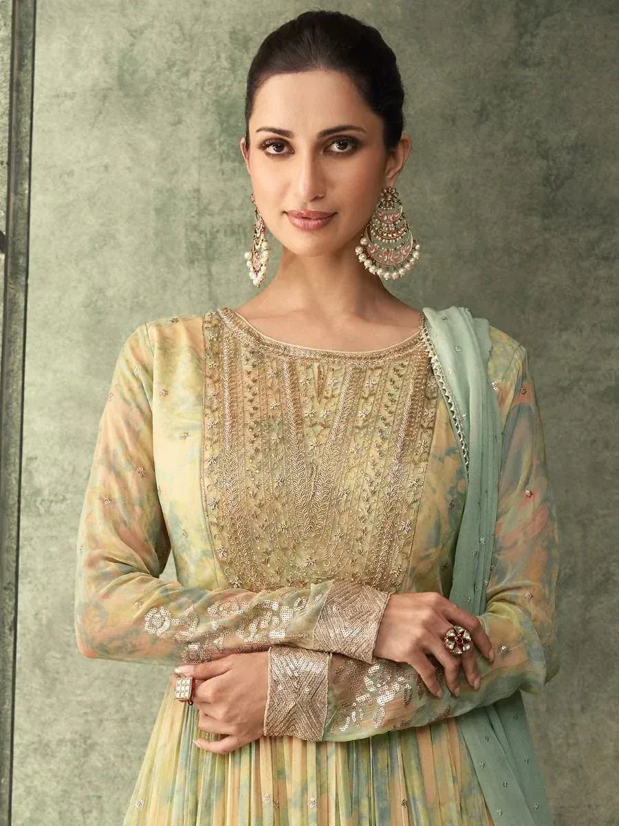 Elegant Indian ethnic wear with intricate gold embroidery, pastel hues, and matching dupatta for festive occasions