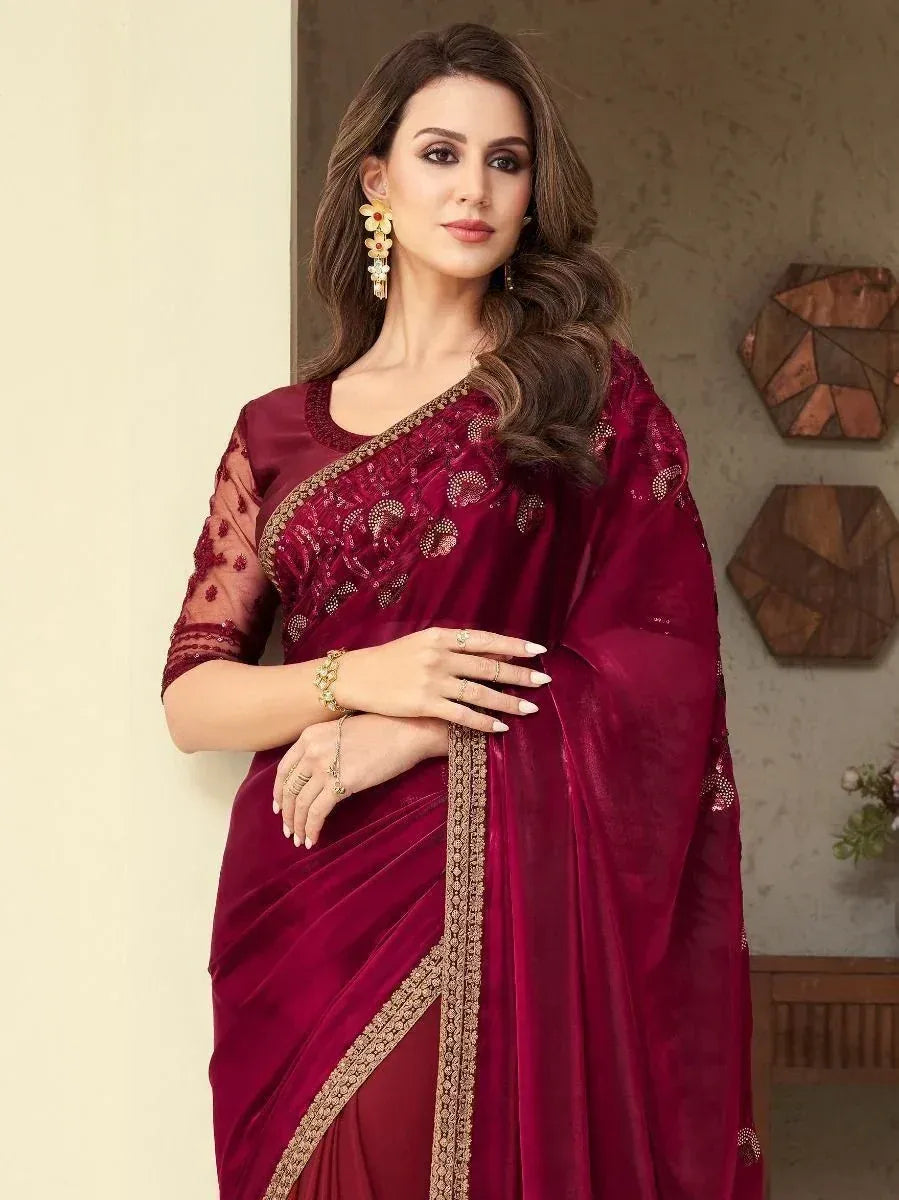 Elegant maroon velvet saree with gold embroidery and sheer sleeves, perfect for Indian ethnic occasions