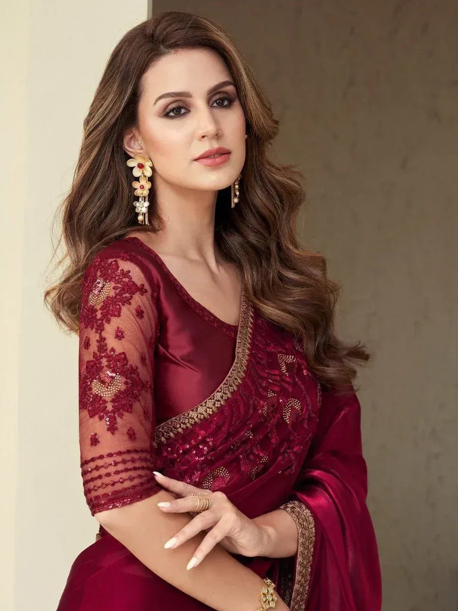Elegant maroon saree with gold embroidery and sheer sleeves, perfect for Indian ethnic occasions