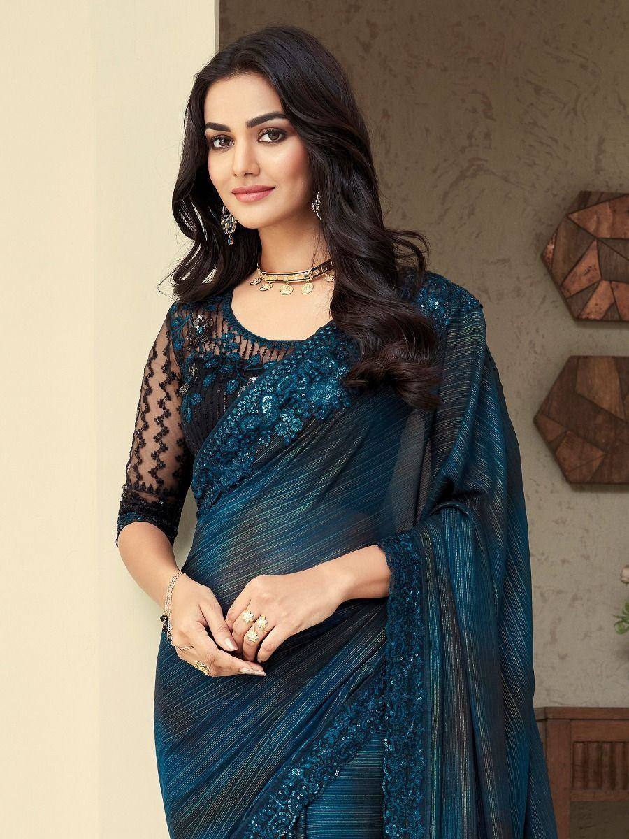 Elegant teal saree with lace blouse and sequin embroidery, perfect for Indian ethnic occasions