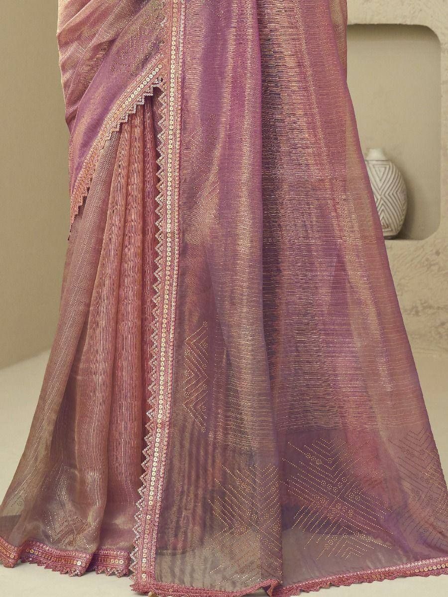 Pink ethnic saree with gold zari work and scalloped border, perfect for Indian occasions