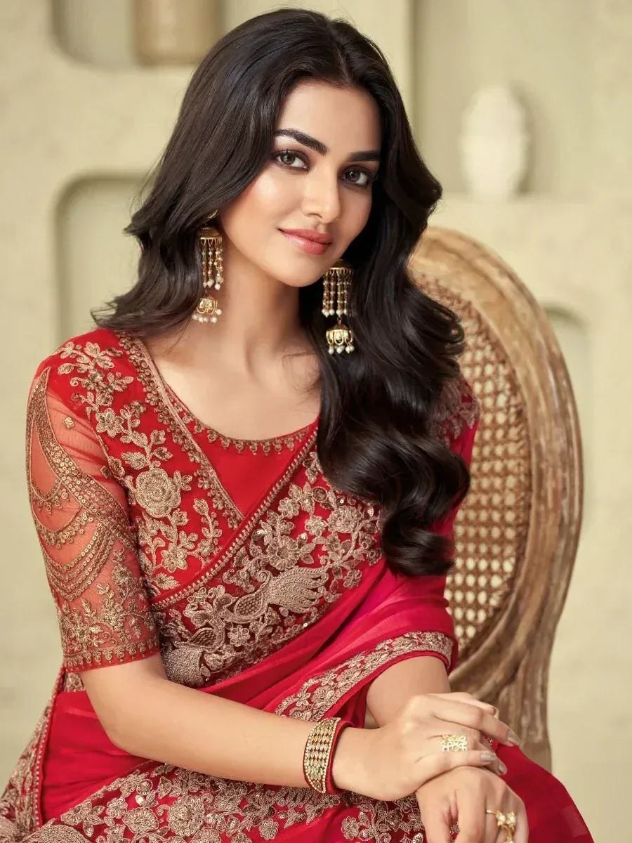 Red embroidered saree with gold detailing, perfect for Indian ethnic wear and festive occasions.