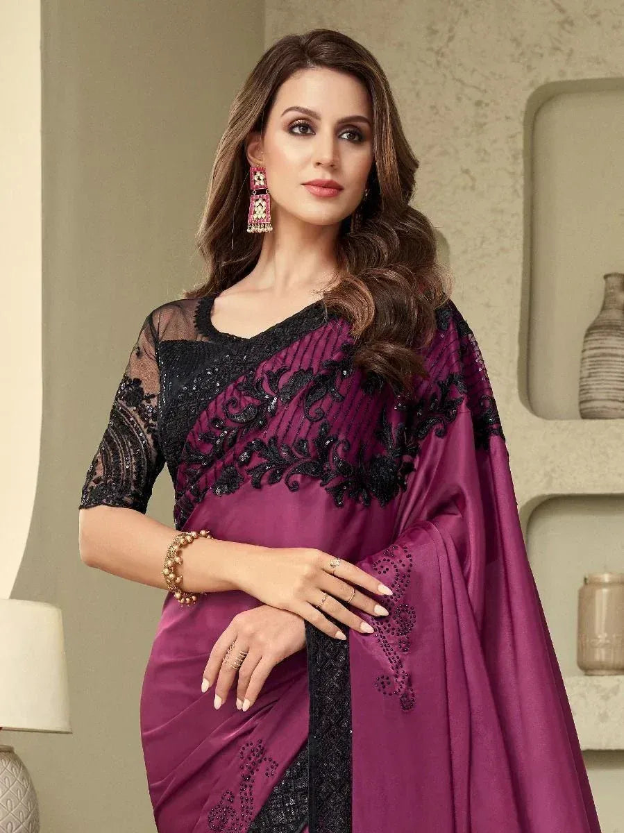 Elegant purple saree with black lace and sequin embroidery, paired with matching blouse for Indian ethnic wear